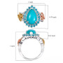 turquoise apatite and multi-color diamond pear halo butterfly ring in tri-tone gold and rhodium over sterling silver shown for size comparison