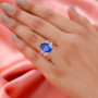 color change fluorite apatite and mother of pearl flower ring in rhodium over sterling silver worn on a hand