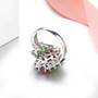 close up of chrome diopside and garnet floral cluster ring in rhodium over 925 sterling silver