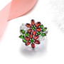 chrome diopside and garnet floral cluster ring in rhodium over 925 sterling silver shown in a lifestyle photo