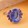 color change fluorite amethyst and zircon fancy halo ring in rhodium over sterling silver shown in a lifestyle photo