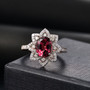 rubellite tourmaline oval and diamond halo ring in 14k yellow gold shown in a lifestyle photo