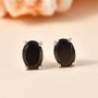 elite shungite oval solitaire stud earrings in rhodium over sterling silver shown in a lifestyle photo