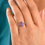 tanzanite pink spinel and moissanite three stone ring in 18k vermeil rose gold over sterling silver on hand model