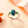 shadowkite and chrome diopside three stone ring in rhodium over sterling silver shown in a lifestyle photo