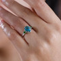shadowkite and chrome diopside three stone ring in rhodium over sterling silver worn on a hand