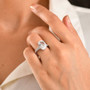 white topaz oval concave cut ring in rhodium over sterling silver worn on a hand
