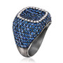 angled view of blue sapphire and diamond cluster ring in black rhodium over white gold