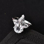 white topaz pear ring in rhodium over sterling silver shown in a lifestyle photo