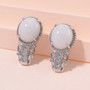 white jade and moissanite drop earring in rhodium over sterling silver shown in a lifestyle photo