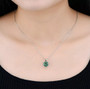 green fluorite round cut pendant necklace in rhodium over sterling silver worn around the neck