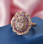 lab created white and purple sapphire halo ring in 18k rose gold over sterling silver shown in a lifestyle photo