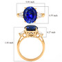 lab blue and white sapphire ring in 18k yellow gold over sterling silver shown for size comparison
