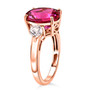 side view of lab created pink sapphire and white sapphire three stone ring in 18k rose gold over sterling silver