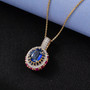 kyanite multi gemstone halo pendant necklace in 18k yellow gold over sterling silver shown in a lifestyle photo