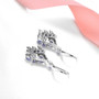 tanzanite and white zircon dangle earrings in rhodium over sterling silver