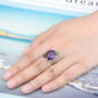 amethyst garnet and chrome diopside ring in rhodium over sterling silver worn on a hand