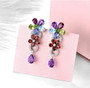 close up of multi gemstone dangle earrings in rhodium over sterling silver