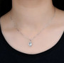 aquamarine and diamond 14k white gold pendant necklace worn around the neck