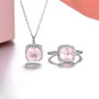rose quartz halo ring and necklace jewelry set in rhodium over sterling silver shown in a lifestyle photo