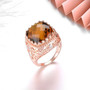 close up of cognac quartz and white zircon ring in 18k rose gold over sterling silver