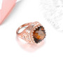 full view of cognac quartz and white zircon ring in 18k rose gold over sterling silver
