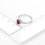 ruby and diamond 18k white gold ring shown for size comparison