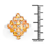 yellow sapphire cluster ring in rhodium over sterling silver shown for size comparison