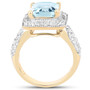 side view of sky blue topaz and white topaz halo ring in 18k yellow gold over sterling silver