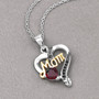 close up of garnet and black spinel pendant in rhodium black rhodium and 18k yellow gold vermeil over sterling silver