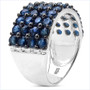 angled view of blue sapphire cluster ring in rhodium over sterling silver