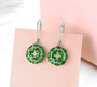 chrome diopside and white zircon earrings in rhodium over sterling silver shown in a lifestyle photo