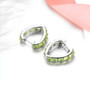 full view of peridot heart hoop earrings in rhodium over sterling silver