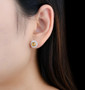citrine and white zircon halo stud earrings in rhodium over 925 sterling silver worn on the ear
