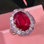 ruby (ff) pink sapphire and zircon double halo ring in rhodium over sterling silver shown in a lifestyle photo