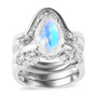 front view of rainbow moonstone and moissanite four ring set in rhodium over sterling silver