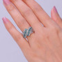 montana sapphire and white zircon bypass crossover rhodium over sterling silver ring on hand model