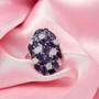 iolite and rainbow moonstone cluster ring in rhodium over sterling silver shown in a lifestyle photo