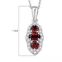 red zircon and moissanite three stone halo pendant necklace in rhodium over sterling silver shown for size comparison