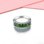 side view of chrome diopside and white zircon band ring in rhodium over sterling silver