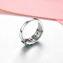 close up of chrome diopside and white zircon band ring in rhodium over sterling silver