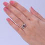 red zircon champagne and white diamond halo ring in 18k vermeil yellow gold over sterling silver on hand model