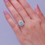 blue zircon freshwater pearl and moissanite double halo ring in rhodium over sterling silver on hand model