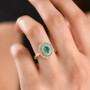 zambian emerald lab grown yellow and white diamond oval double halo ring in 10k yellow gold on hand model