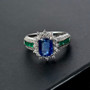 kyanite emerald and white zircon halo ring in rhodium over sterling silver shown in a lifestyle photo
