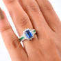 kyanite emerald and white zircon halo ring in rhodium over sterling silver worn on a hand