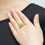 peridot cluster ring in rhodium over sterling silver worn on a hand