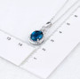 london blue topaz and diamond pendant necklace in 14k white gold shown for size comparison