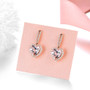 close up of brazilian pink amethyst and white zircon heart earrings in 18k rose gold over sterling silver
