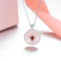 garnet cabochon and mother of pearl necklace in rhodium over sterling silver shown in a lifestyle photo